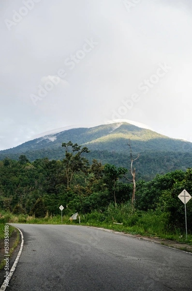 Obraz Beautiful road view with hill background. Mount Tandikat in West Sumatera.