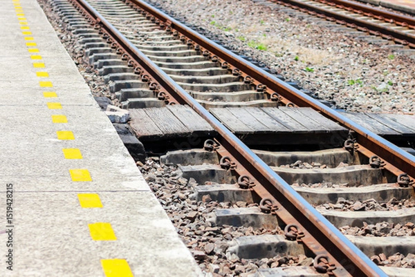 Obraz Pictures of railroad tracks in concept train station.