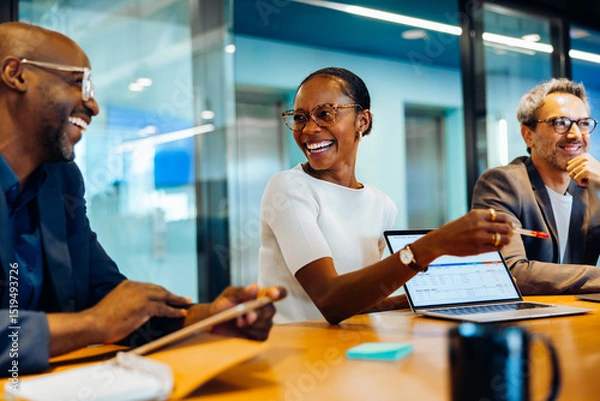 Obraz Diverse group discussing ideas in a bright and engaging office setting