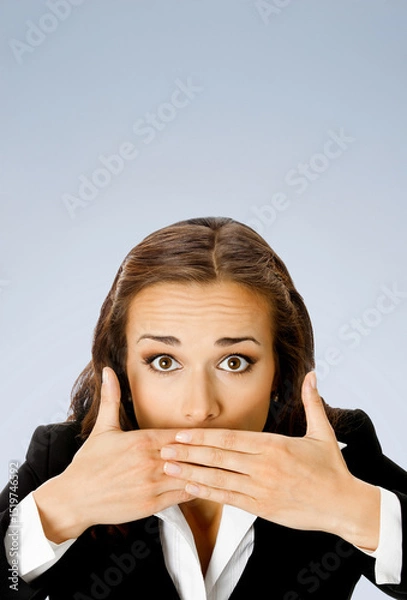 Fototapeta Wow! Expressive surprised, astonished shocked businesswoman keep hands over face. Amazed corporate business woman cover mouth, isolated grey gray background. Vertical banner image with free text space