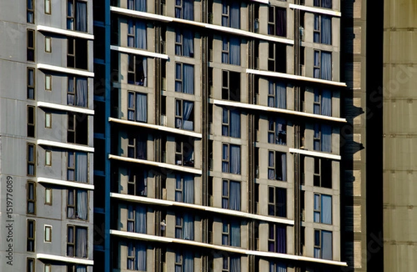 Fototapeta Modern Apartment Building Facade with Repetitive Window Pattern