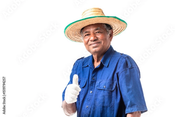 Fototapeta Portrait of elderly Asian man farmer wears a hat, blue shirt thumbs up and looking at camera, isolated on white background with clipping path.