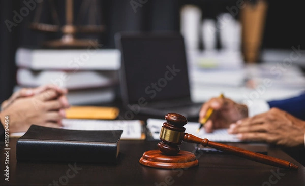 Obraz Lawyer reviewing contract agreement with legal documents, Discussing contract agreement at desk with legal document.