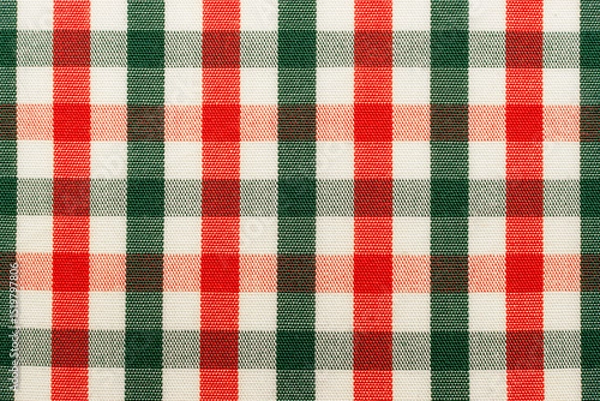 Fototapeta The texture of linen fabric in a large cage of green, red and white. Scottish tailoring material. Checkered fabric