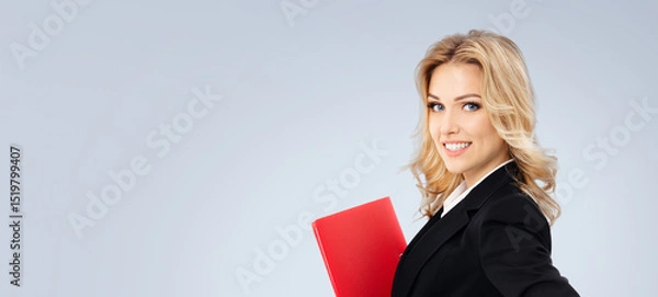 Fototapeta Portrait image - happy smile business woman businesswoman teacher manager real estate agent hold red folder. Blond hair girl in black jacket. Isolated grey gray background. Ad concept. Free text space