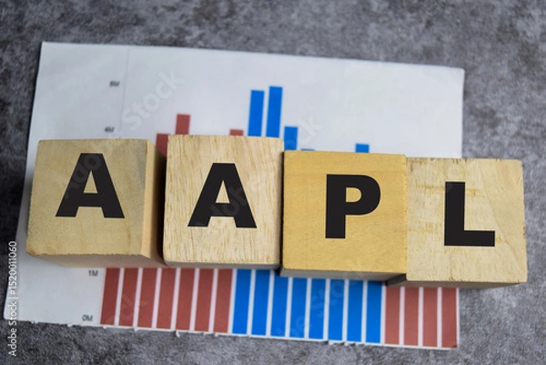 Fototapeta Concept of AAPL Symbol. Wooden block with words AAPL. stock chart concepts