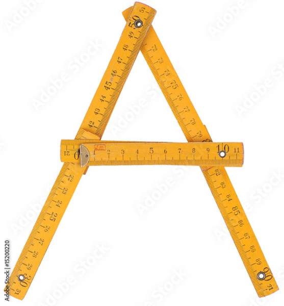 Obraz old yellow ruler forming font symbol A