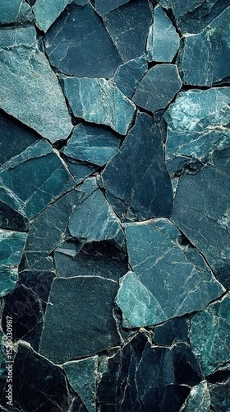 Fototapeta Close-up view of a wall of dark teal stone tiles