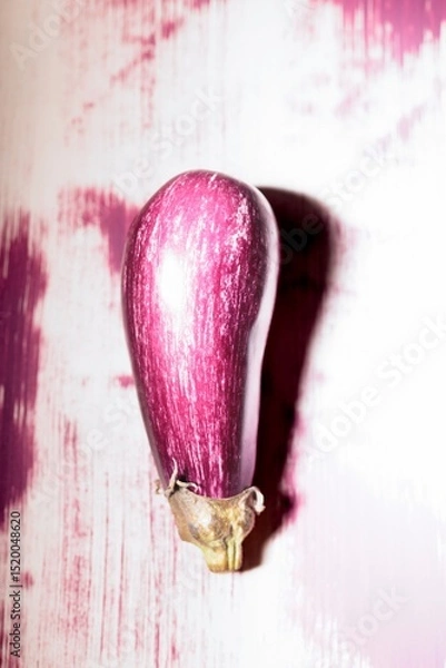 Obraz Colorful graffiti displays a striking eggplant design against a textured wall, blending street art with playful imagery, bringing life to the urban environment during the day