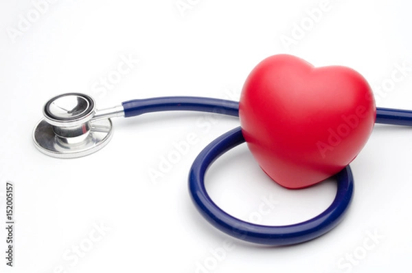 Fototapeta red heart and a stethoscope on white background, health care medical technology concept, soft focus, selective focus.