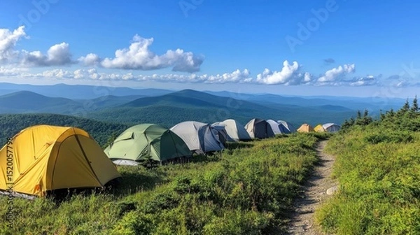 Fototapeta Tents set up on a mountain ridge