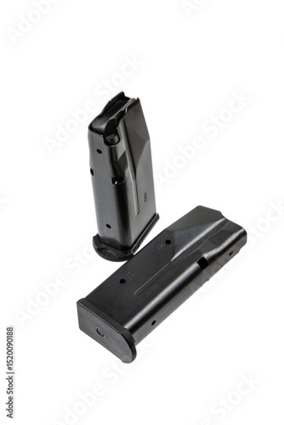 Fototapeta Two black metal pistol magazines for 9mm ammunition, displayed on white back