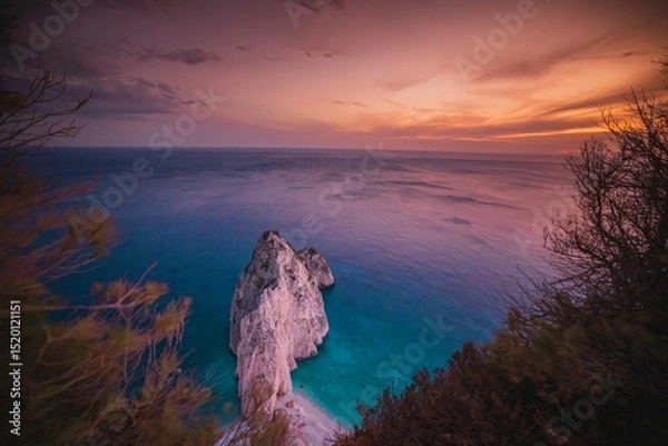 Obraz Witness a serene Zakynthos sunset where vibrant colors blend over calm seas