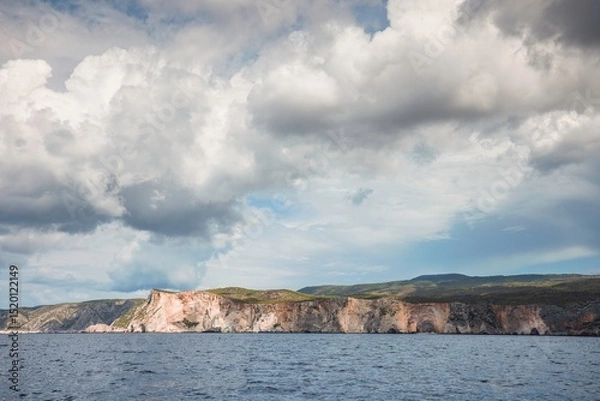 Obraz Explore the stunning cliffs of Zakynthos against a backdrop of dramatic clouds and tranquil waters, capturing the essence of summer tourism in this idyllic Greek paradise