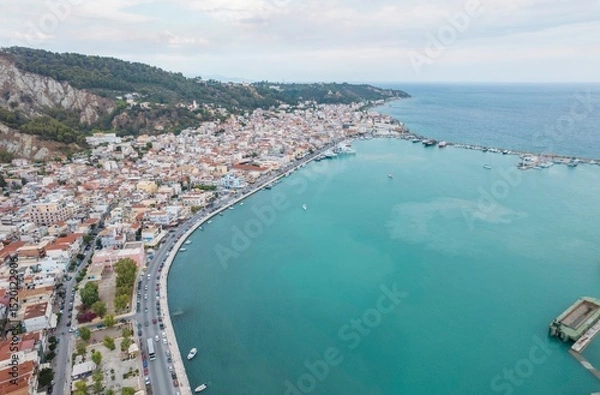 Obraz Vivid colors capture the essence of Zakynthos, where bustling streets meet mesmerizing waters on a sunny summer day. Tourists enjoy the lively atmosphere and breathtaking scenery