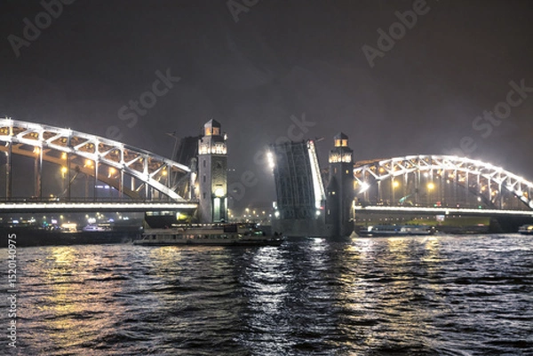 Fototapeta The Bridge of Peter the Great. Bridge in St. Petersburg. Bolsheokhtinsky Bridge. Drawbridge. Bolsheokhtinsky bridge in St. Petersburg at night with open spans over the Neva.