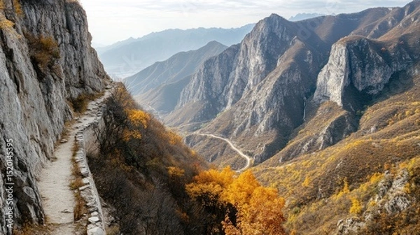 Fototapeta Isolated section of the Great Wall winding around a sharp mountain curve with dramatic landscape