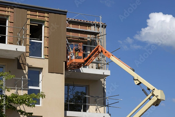 Obraz  Isolation et bardage extérieur d'un immeuble d'habitation en construction