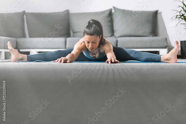 Obraz Stretching routine at home with a focus on flexibility and relaxation during morning practice