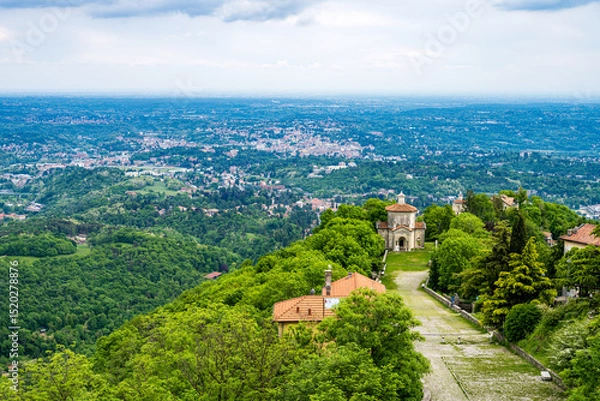 Obraz varese, italy:: medieval chapel of the sacro monte di varese in italy, smoke cloud in the city, pollution, weekend walk in pandemic