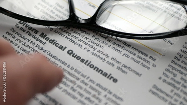 Obraz Finger tapping on medical questionnaire form