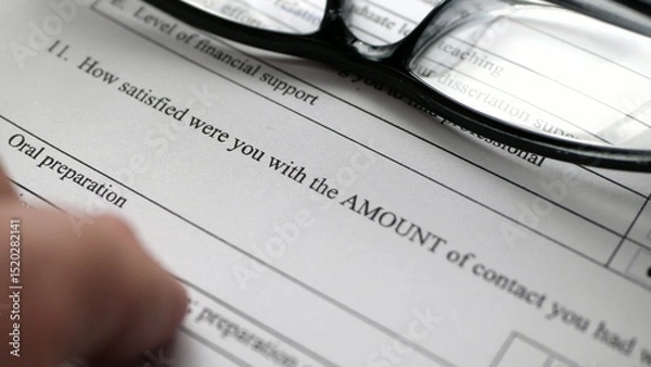 Obraz Finger tapping on survey form