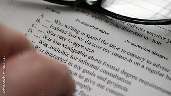 Obraz Finger tapping on survey form