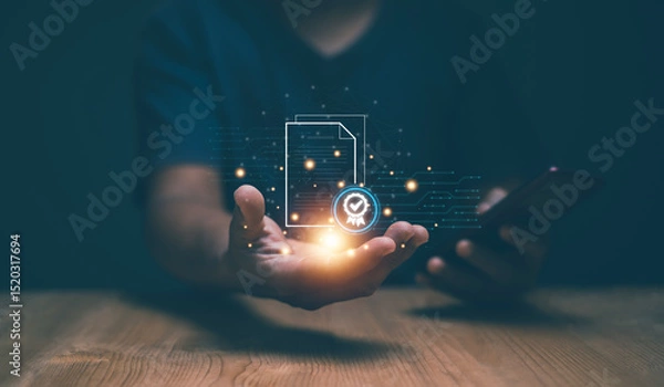 Fototapeta Document audit for business concept. Businessman holding file document with check mark hologram in hand. Approval and online evaluation with smartphone. Quality control. File certificate.
