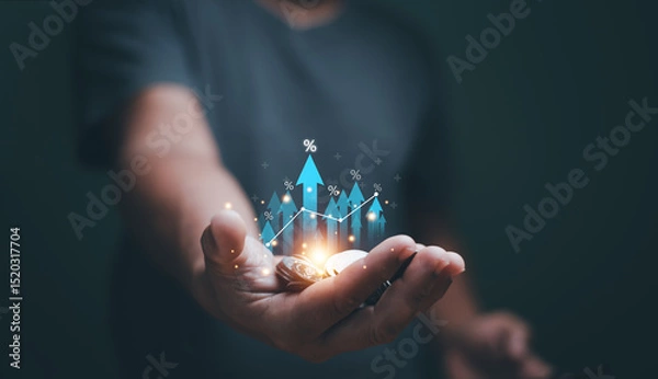 Fototapeta Business growth concept. Businessman 'hand holding heap of coins and arrow up with percentage symbol for financial increase interest rate or mortgage investment dividend. Saving money.