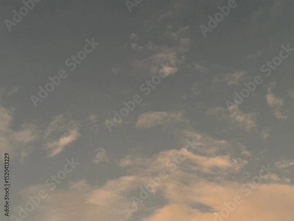 Obraz calm sky photo with soft and thin clouds golden light of the sun, light and shadow on the clouds create texture, bright blue sky calming background. Suitable for nature, tranquility, weather, freedom