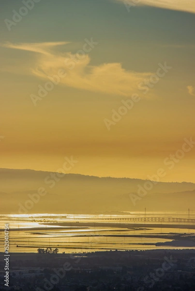 Obraz Dumbarton Bridge at sunset with reflections over Baylands water in the South Bay