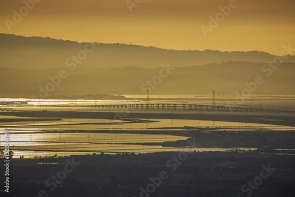 Obraz Dumbarton Bridge at sunset with reflections over Baylands water in the South Bay