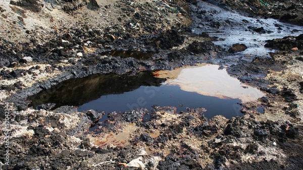 Fototapeta Former dump toxic waste, oil lagoon contamination. Nature effects from water and soil contaminated with oil and chemicals, environmental disaster, contamination of the environment, Moravia, Europe