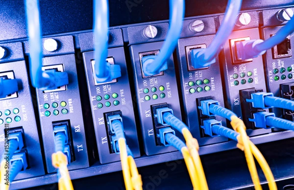 Obraz server with fiber optic cables  and network cable in data center