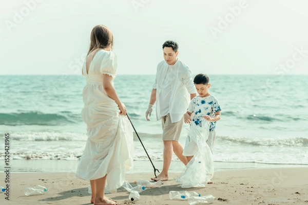 Fototapeta Family carry a bag to collect trash on the beach and clean up the dirty sea while collecting reusable plastic bottles.