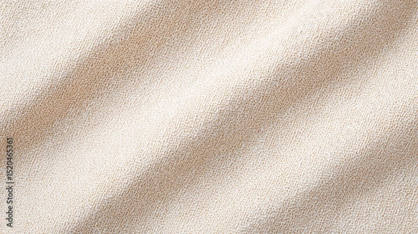 Fototapeta Close up detailed texture of soft beige knitted fabric showing warm cozy pattern and natural fiber threads for textile and fashion background