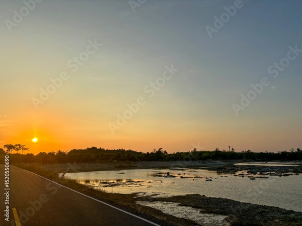 Fototapeta Tranquil View of Talay Prong Lake at Dusk in the Countryside of Nakhon Si Thammarat, Thailand