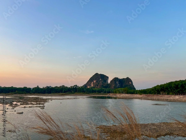 Fototapeta Tranquil View of Talay Prong Lake at Dusk in the Countryside of Nakhon Si Thammarat, Thailand
