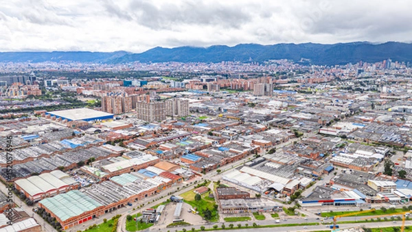 Fototapeta Aerial View of Bogotá's Urban Landscape with Mountains in the Background