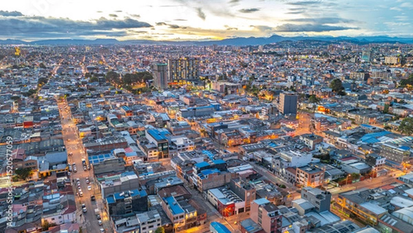 Fototapeta Aerial View of Bogotá at Dusk, Showcasing the Urban Landscape of Cundinamarca, Colombia