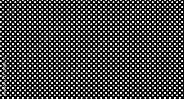 Obraz A repeating pattern of white circles on a black background creating a polka dot design effect