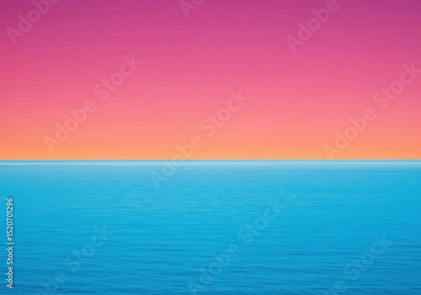 Fototapeta The calm ocean meets a colorful sky