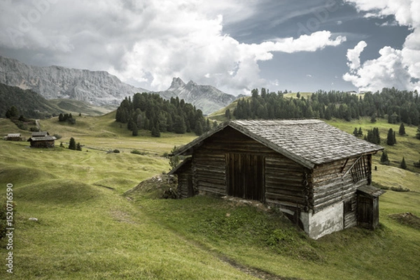 Obraz small house over a mountain pasture in Dolomites with wonderful panorama