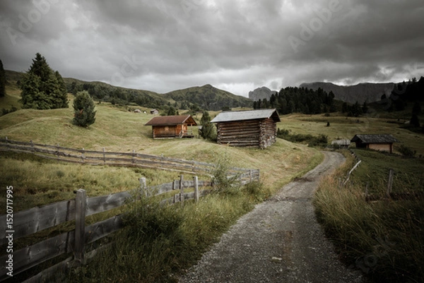 Obraz small house over a mountain pasture in Dolomites with wonderful panorama