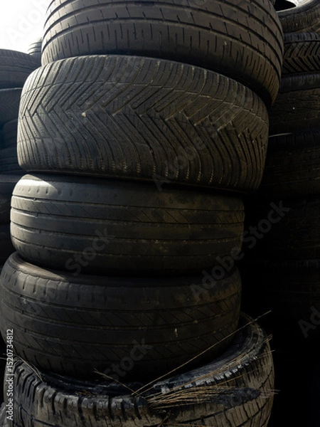 Obraz Industrial storage of used tires for recycling and sustainable environmental management