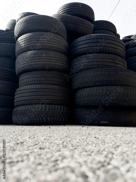 Obraz Industrial storage of used tires for recycling and sustainable environmental management
