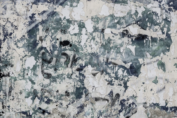 Fototapeta  Abstraction of crumbling graffiti on a city street wall. Colorful abstract background. Old, cracked, peeling paint on the wall as a background.Abstract background in neutral calm colors.