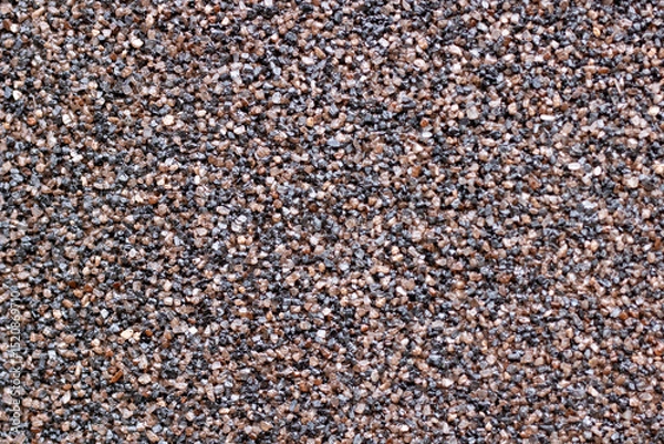 Fototapeta A detailed close up of a pile composed of brown and black gravel