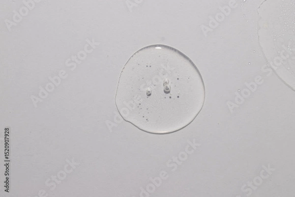 Fototapeta Top view of trasparent  circule dropl place, serum toner cream swatch texture
