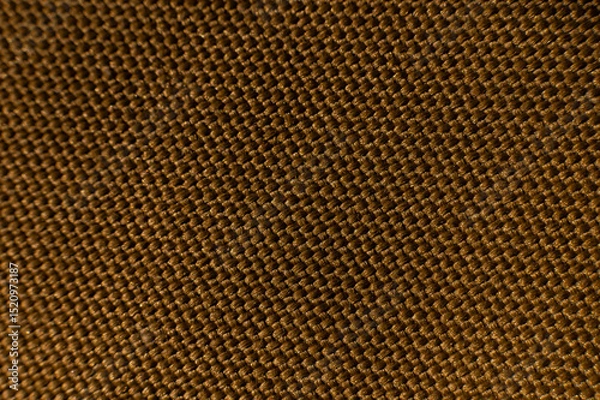 Obraz Close-up texture of textile surface. Extreme macro close-up of synthetic fabric surface. Gold background in shallow depth of field